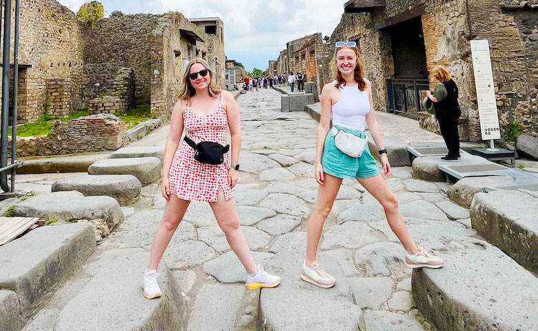 Emmie Burgess (right) and a friend explore the ancient Italian city of Pompeii, much of which was buried under volcanic ash following the eruption of Mount Vesuvius in 79 AD.
