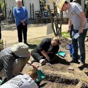 Wes Newton (center), a senior anthropology major from Guntown, helps fellow Ole Miss students at the Hugh Craft House excavation site in Holly Springs during the annual Behind the Big House program. Submitted photo